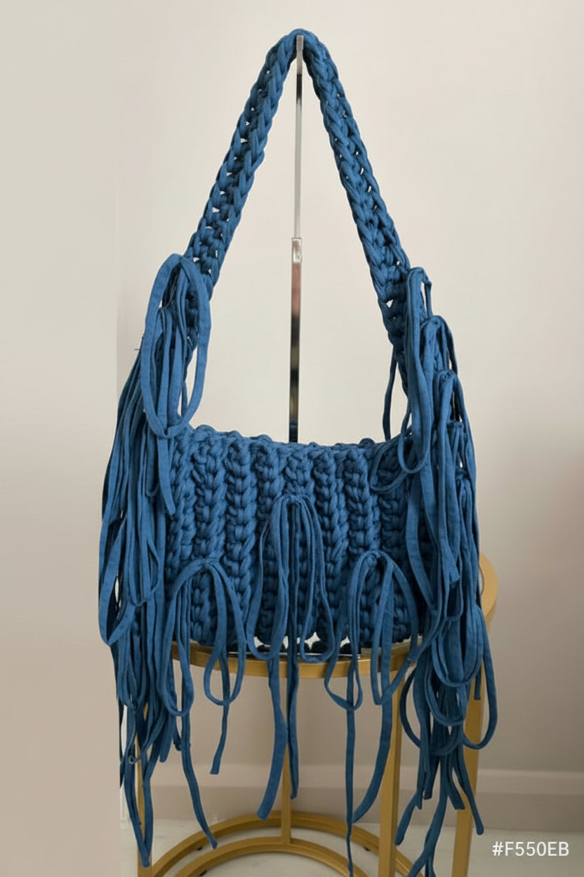 A blue fringed crochet and braided handbag 