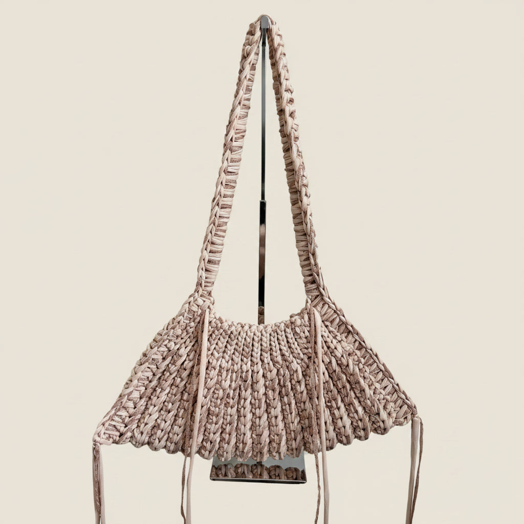 Chunky crochet shoulder bag in beige and gold.