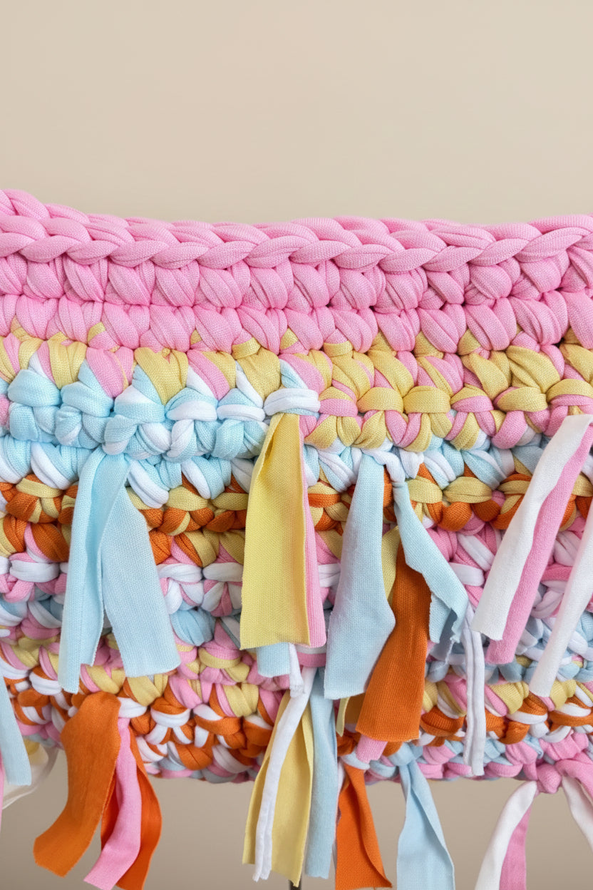 A close-up of a chunky crochet bag 